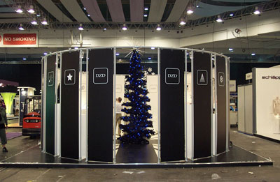 Dark slate-grey vertical screens forming a circle