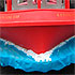 Close-up detail of a parade float in the form of a red boat